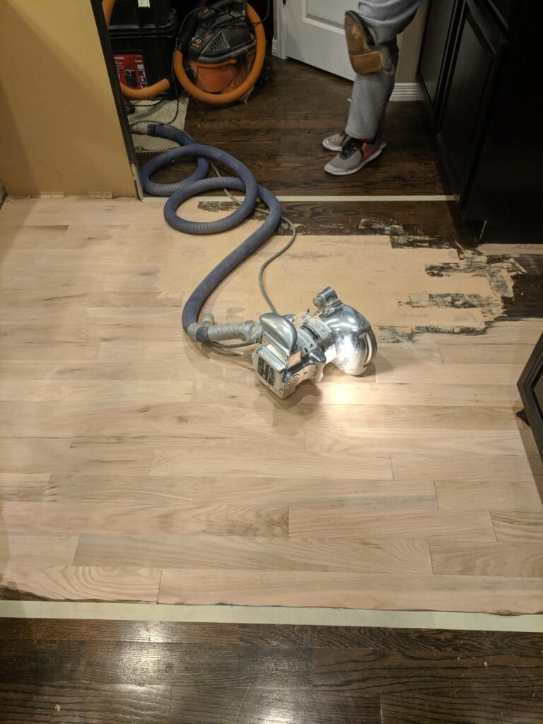 Hardwood floor restoration and refinishing process